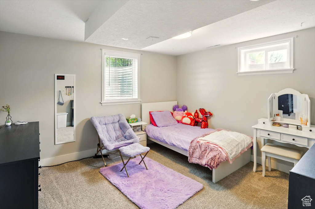 Carpeted bedroom with baseboards