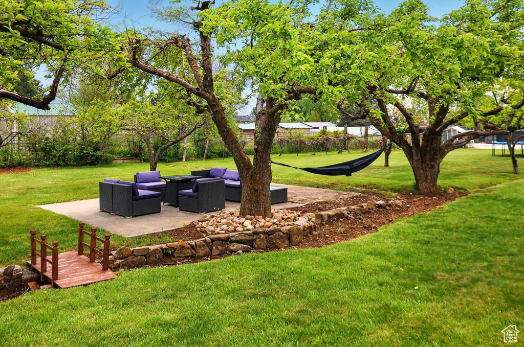 View of yard with a patio and outdoor lounge area