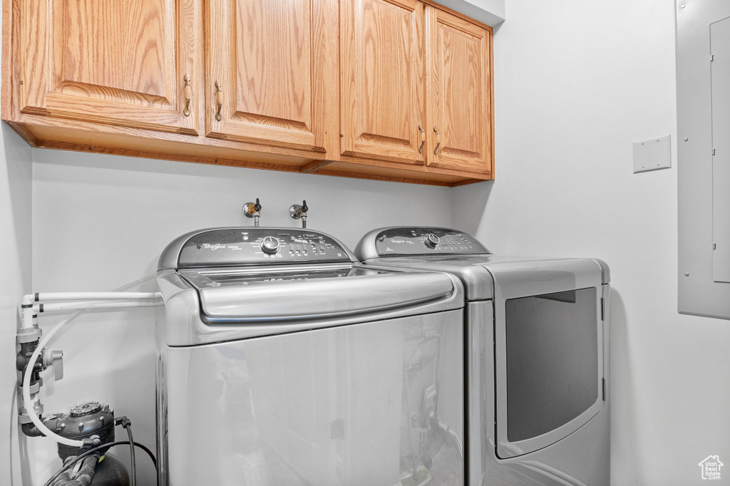 Laundry area with washing machine and clothes dryer and cabinet space
