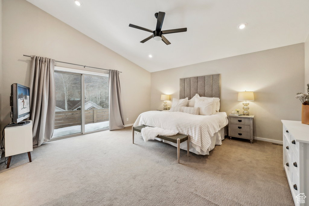 Bedroom with baseboards, light carpet, lofted ceiling, and access to exterior