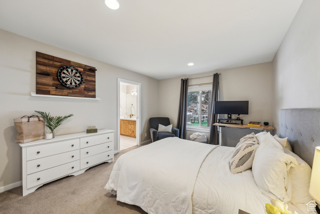 Bedroom with baseboards, light carpet, connected bathroom, and recessed lighting