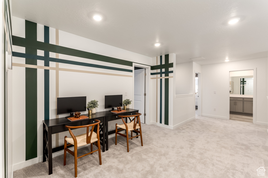 Office area featuring light carpet, baseboards, and recessed lighting