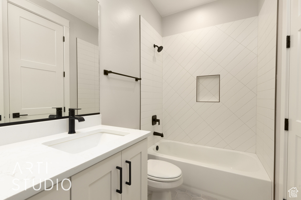 Full bathroom with toilet, shower / tub combination, and vanity