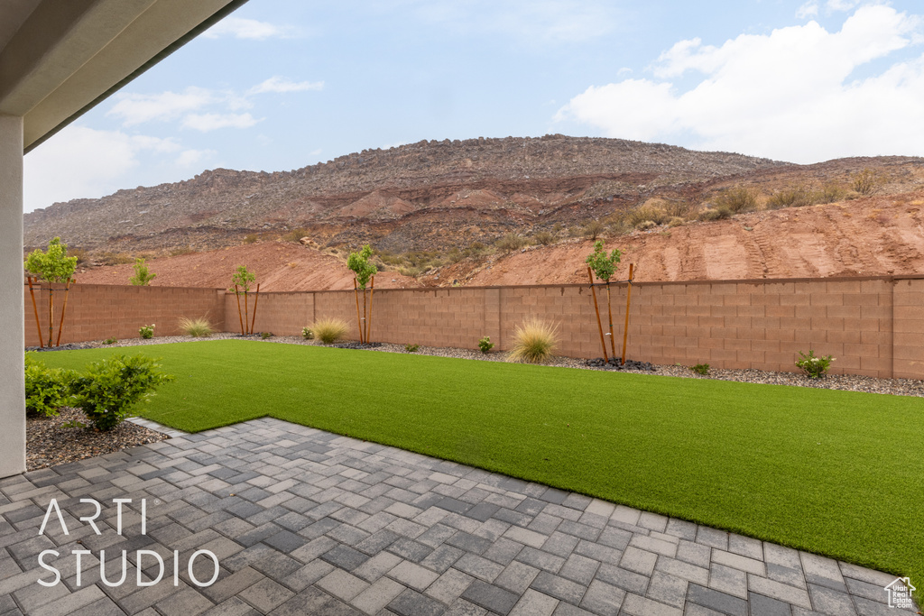 View of yard with a patio area and a mountain view