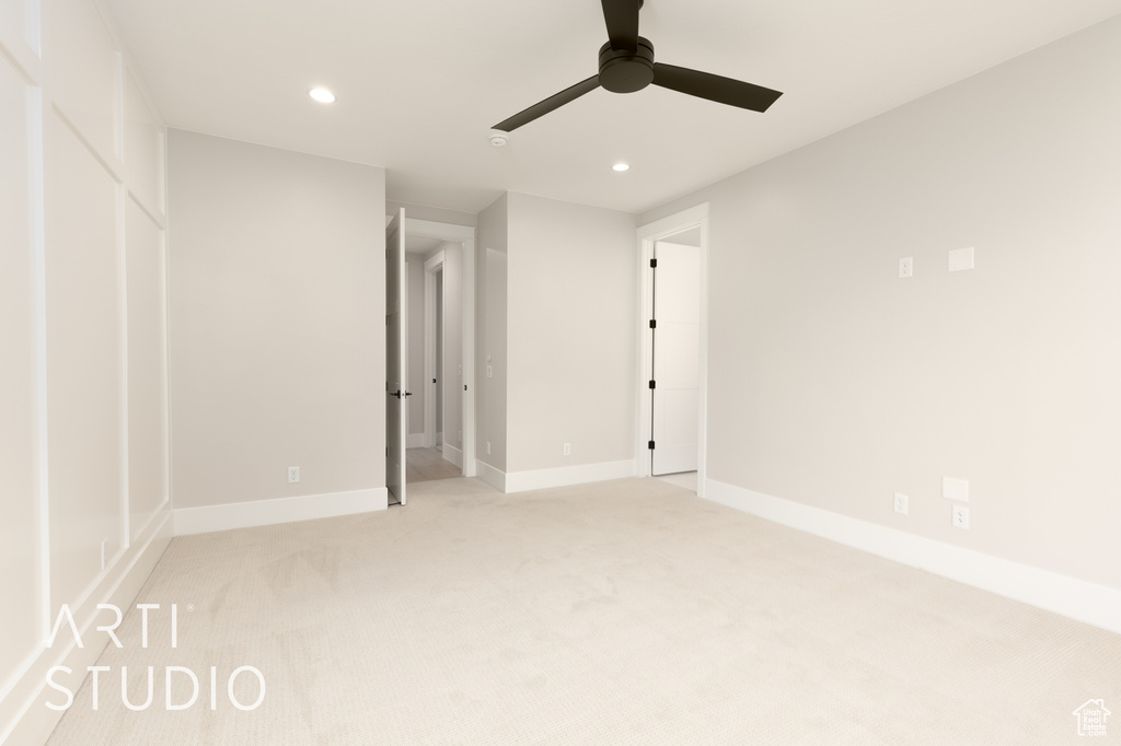 Unfurnished bedroom with recessed lighting, light colored carpet, baseboards, and ceiling fan