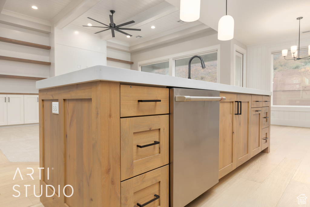 Kitchen featuring beam ceiling, light wood-style flooring, light countertops, dishwasher, and a ceiling fan