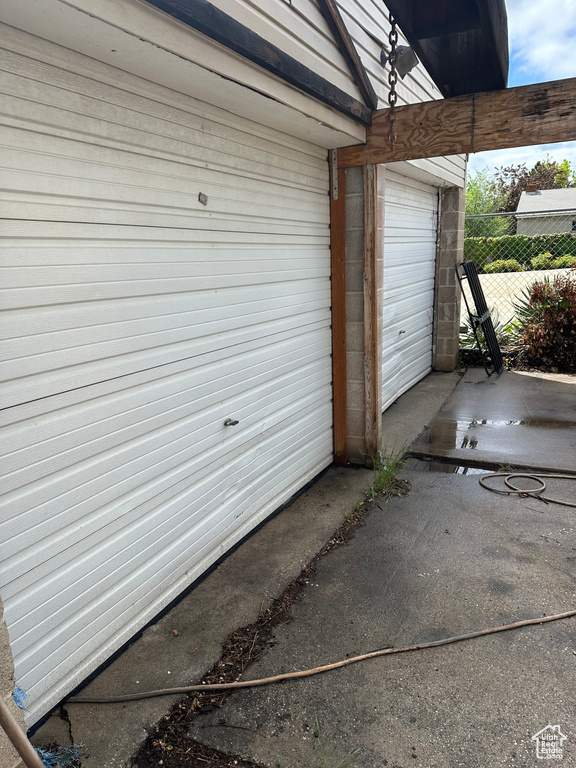 Garage featuring fence