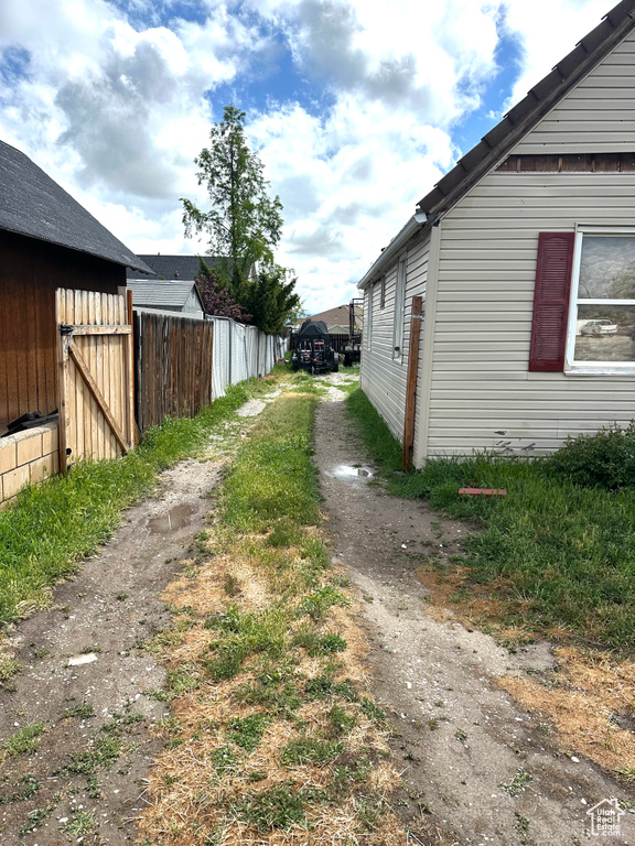 View of home's exterior with fence
