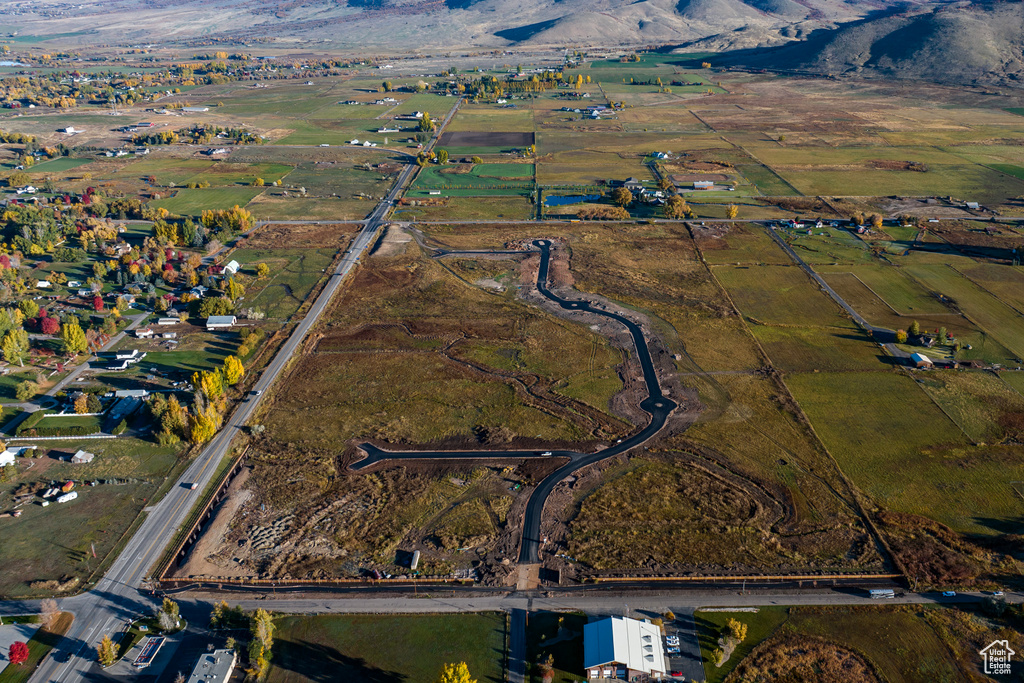 Birds eye view of property with a rural view and a mountain view
