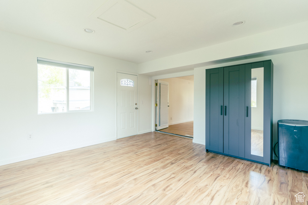 Interior space featuring light wood-style flooring, baseboards, and recessed lighting