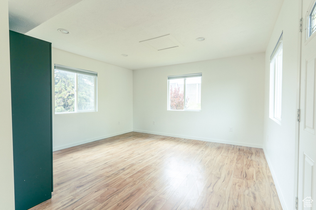 Spare room with light wood-style floors and baseboards