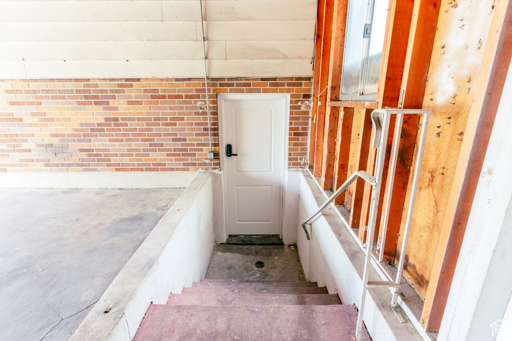 Staircase with brick wall