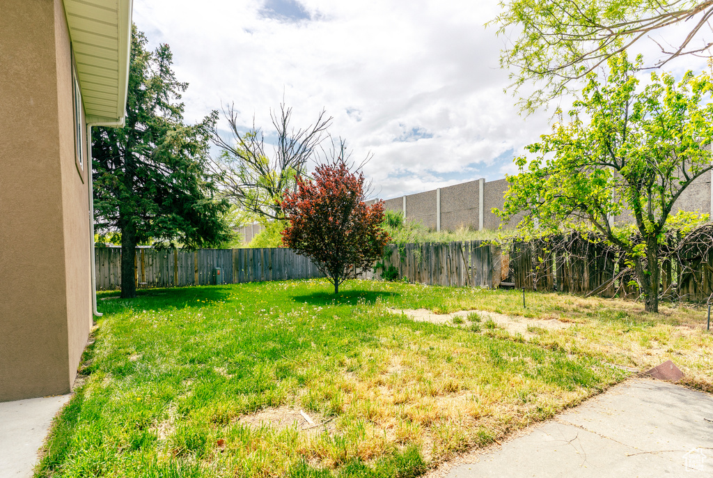 View of yard with a fenced backyard