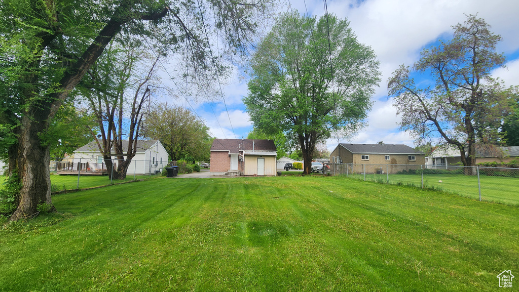 View of yard featuring fence