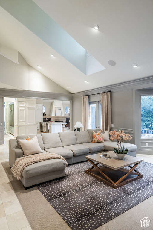 Living area featuring recessed lighting and vaulted ceiling with skylight