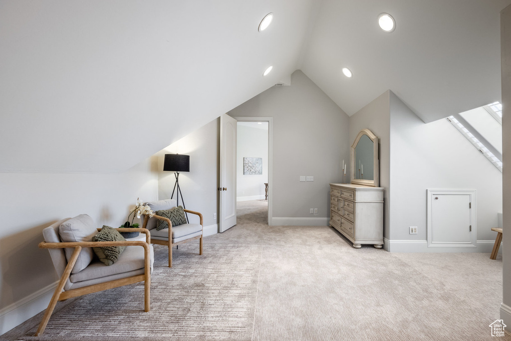 Living area featuring baseboards, recessed lighting, carpet, and vaulted ceiling