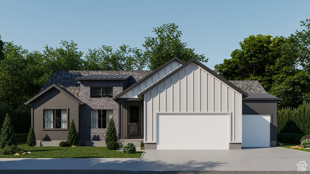 Modern farmhouse style home featuring an attached garage, board and batten siding, and concrete driveway