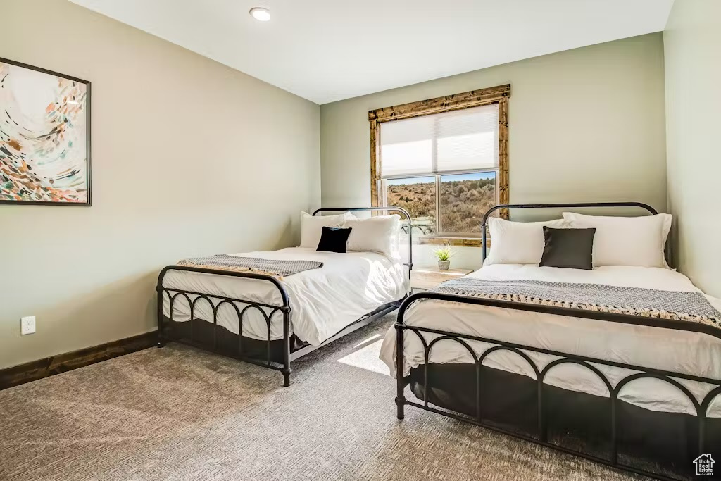 Bedroom with carpet flooring, baseboards, and recessed lighting