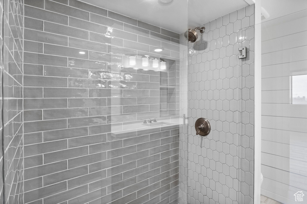 Full bath with a tile shower