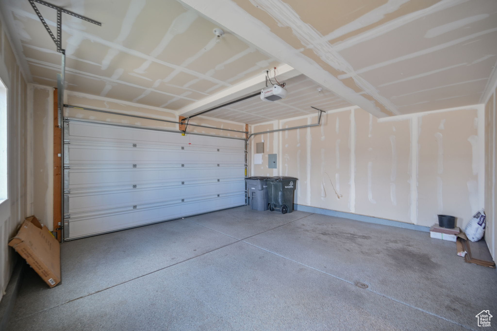 Garage featuring a garage door opener