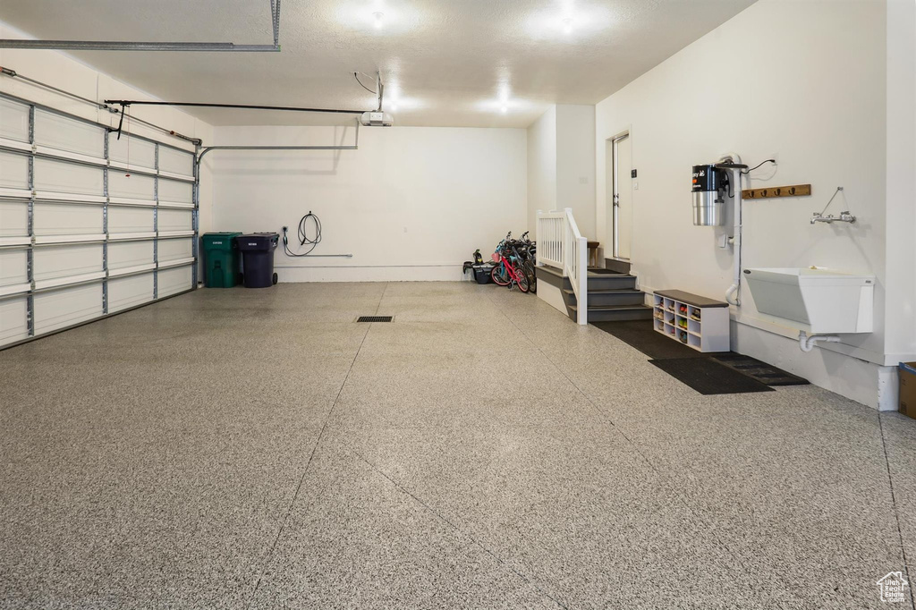 Garage featuring a garage door opener