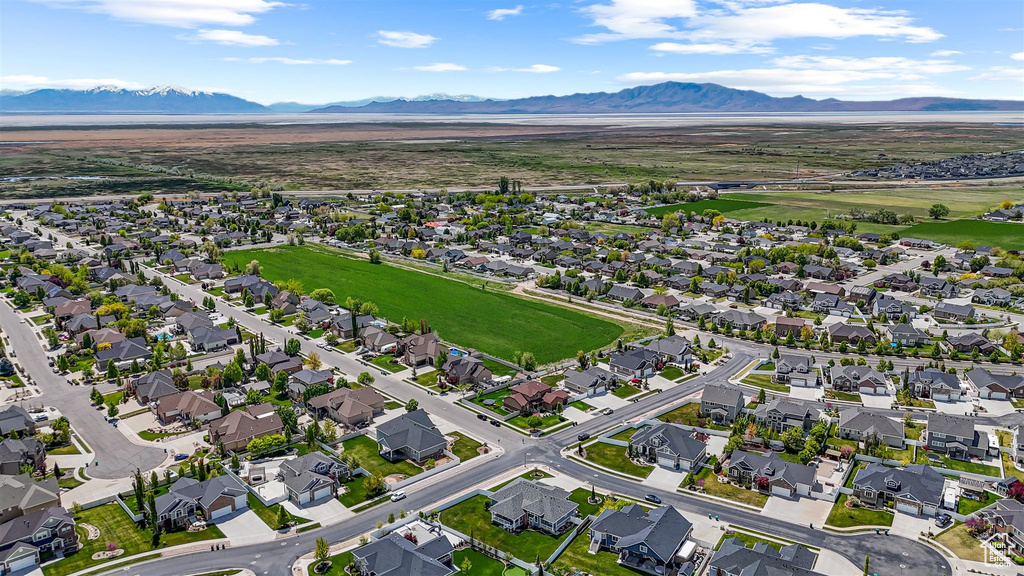 Drone / aerial view with a residential view and a mountain view
