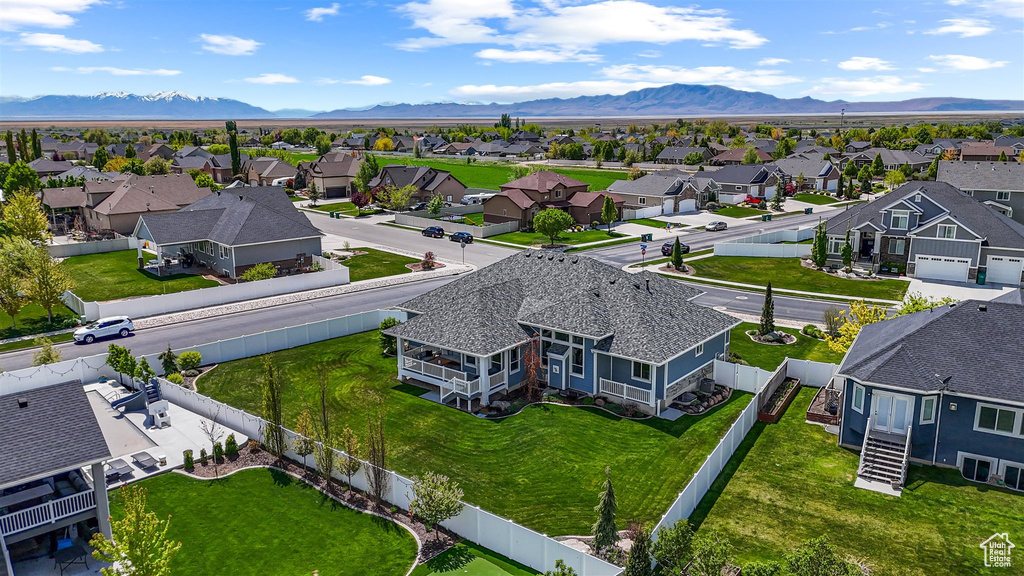 Drone / aerial view with a residential view and a mountain view