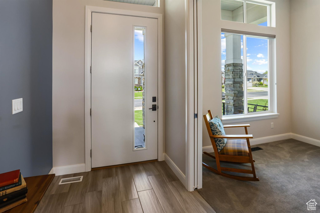 Entrance foyer featuring a wealth of natural light, baseboards, and visible vents