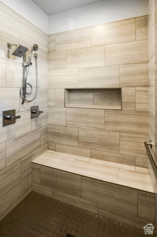 Full bath featuring a sauna and a tile shower