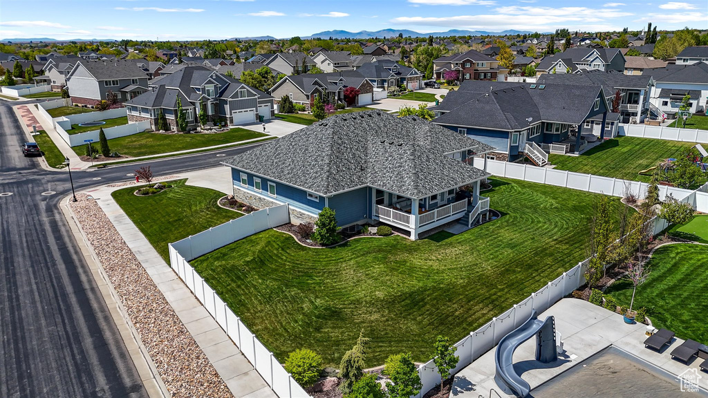 Birds eye view of property featuring a mountain view and a residential view