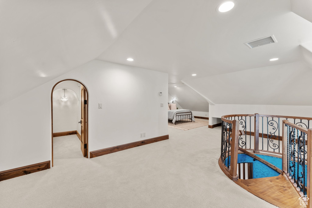 Bonus room with recessed lighting, visible vents, vaulted ceiling, and baseboards