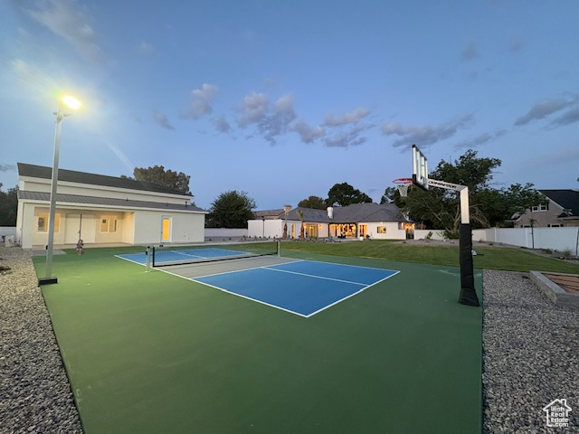 View of tennis court with fence