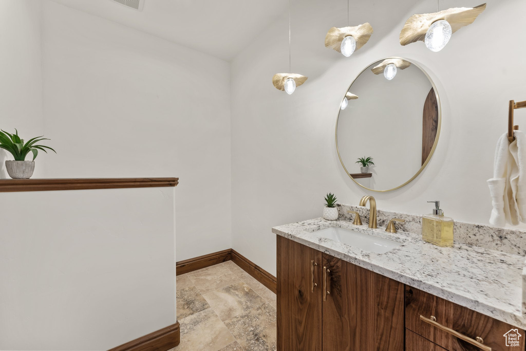 Bathroom with vanity and baseboards
