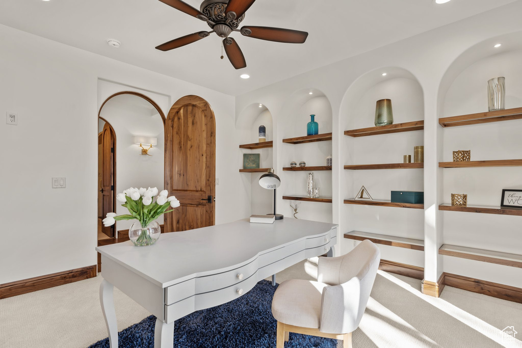 Carpeted home office featuring built in features, recessed lighting, ceiling fan, and baseboards