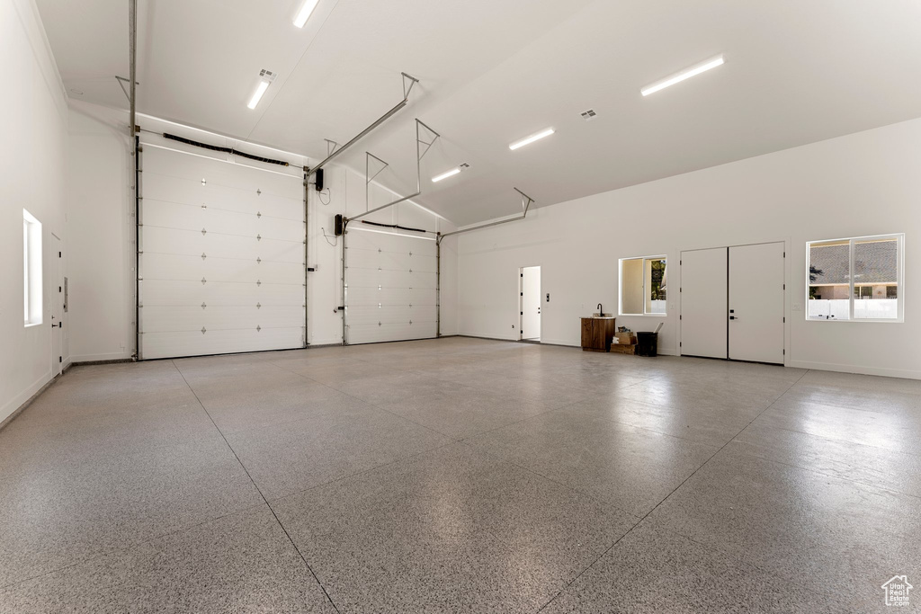 Garage featuring baseboards