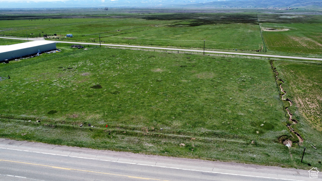 Overview of rural landscape featuring agricultural land and mountains