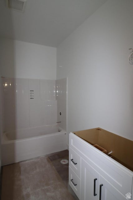 Full bathroom with visible vents and bathtub / shower combination