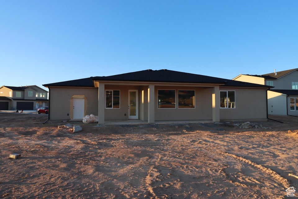Back of property with stucco siding