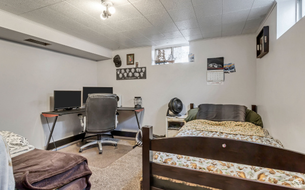 Bedroom featuring carpet flooring and visible vents