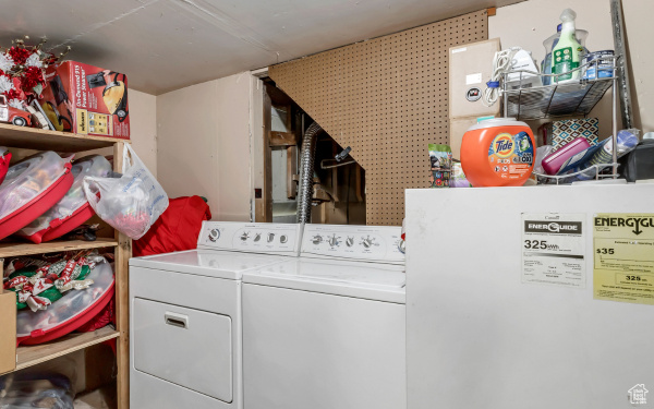 Washroom with separate washer and dryer and laundry area