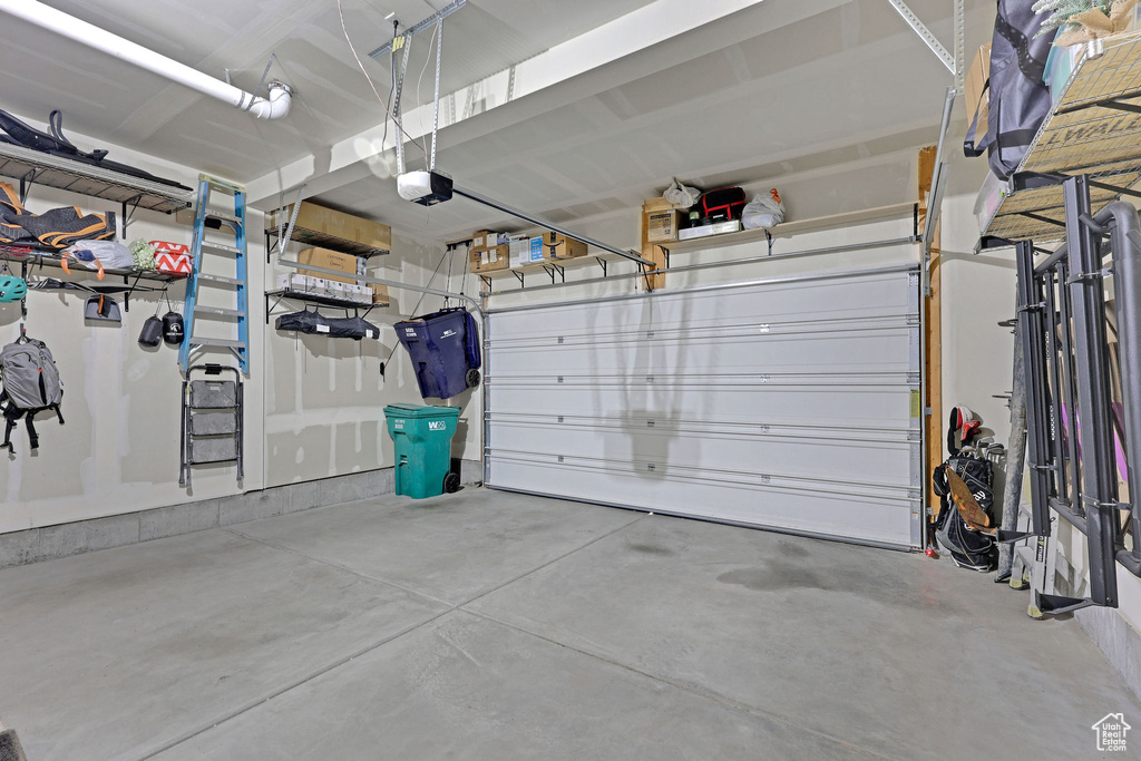Garage featuring a garage door opener