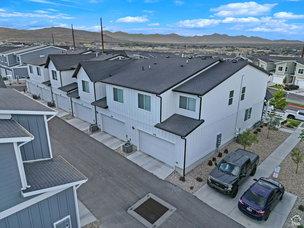 Drone / aerial view with a residential view and a mountain view