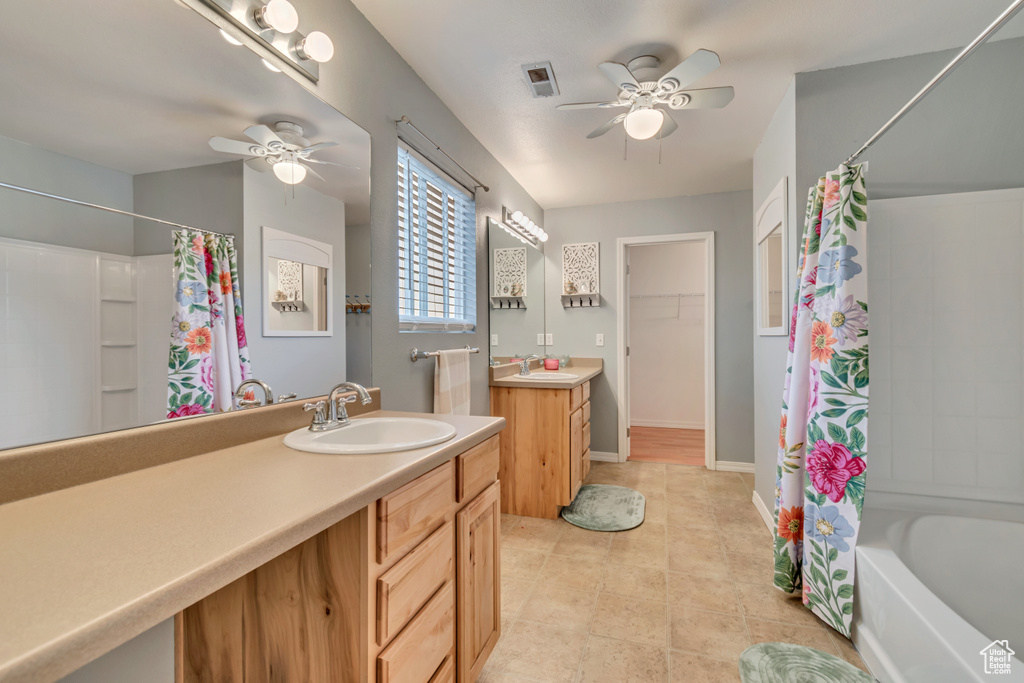 Full bath featuring visible vents, ceiling fan, and a sink