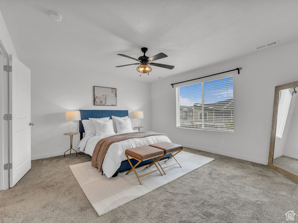 Bedroom with carpet, baseboards, and visible vents