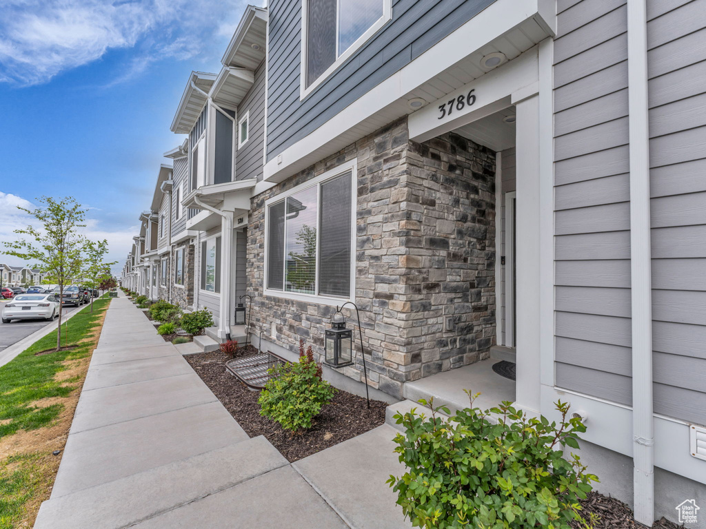 View of side of home with stone siding