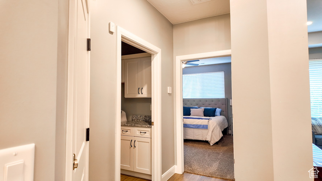 Hallway with light wood-type flooring