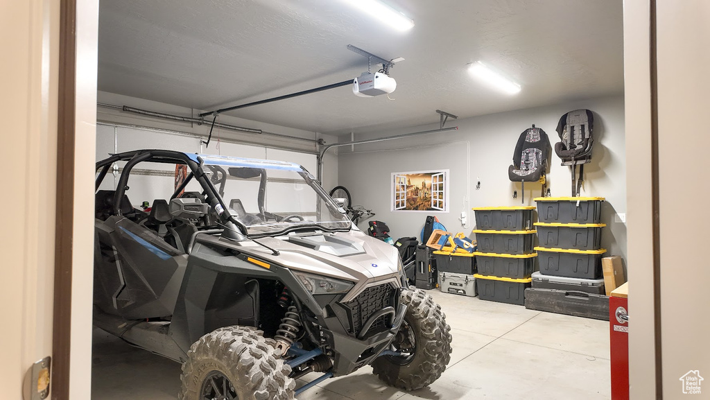 Garage featuring a garage door opener