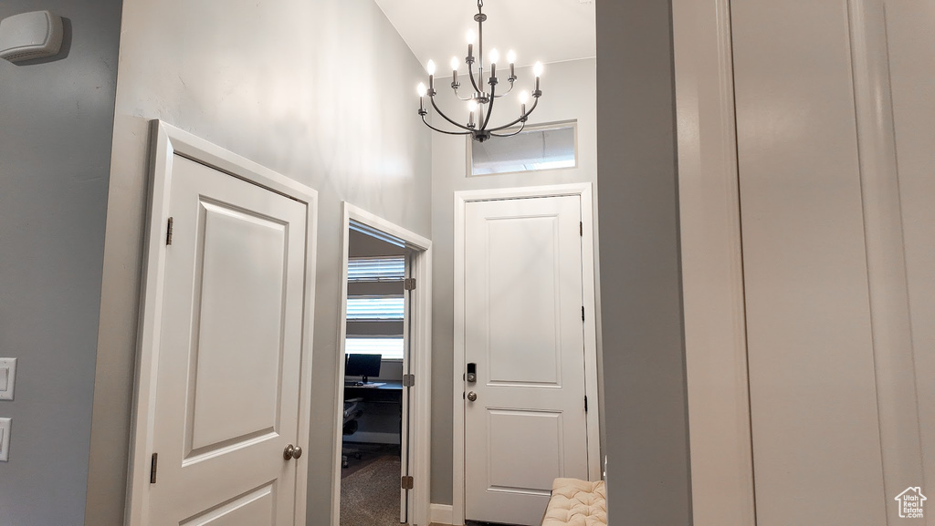 Entryway with a notable chandelier
