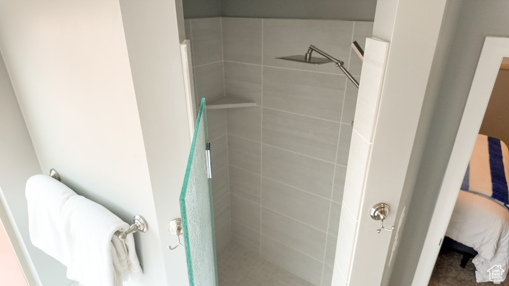 Ensuite bathroom featuring a shower stall and ensuite bathroom