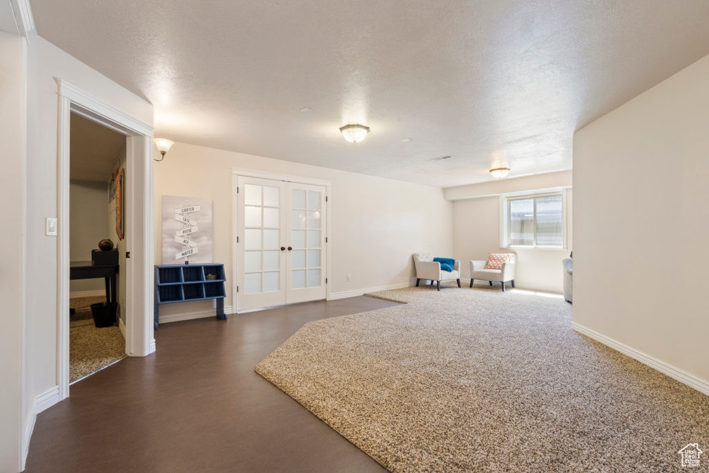 Interior space featuring french doors and baseboards